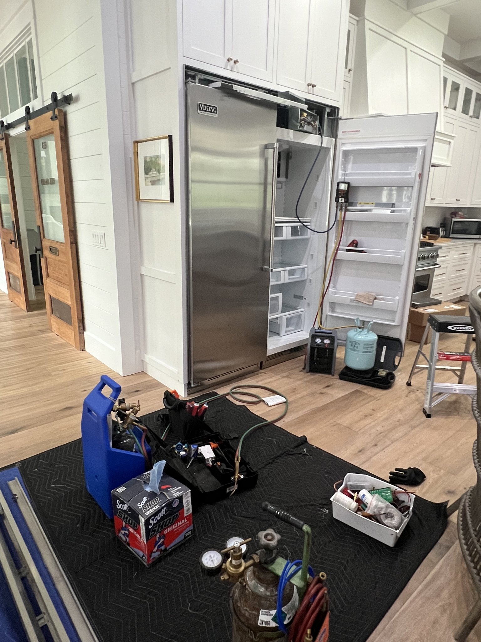 Fixer Service Viking refrigerator repair service call in progress with tools laid out — Tampa Bay